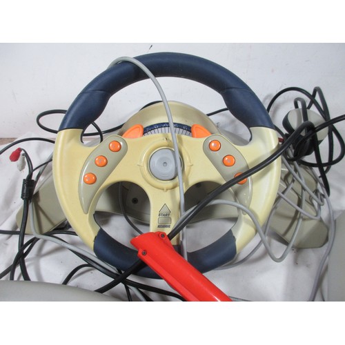 57 - A Sega Dreamcast Set up to include foot pedals ,Steering wheel ,Disc holder and a separate Gun ,may ... 