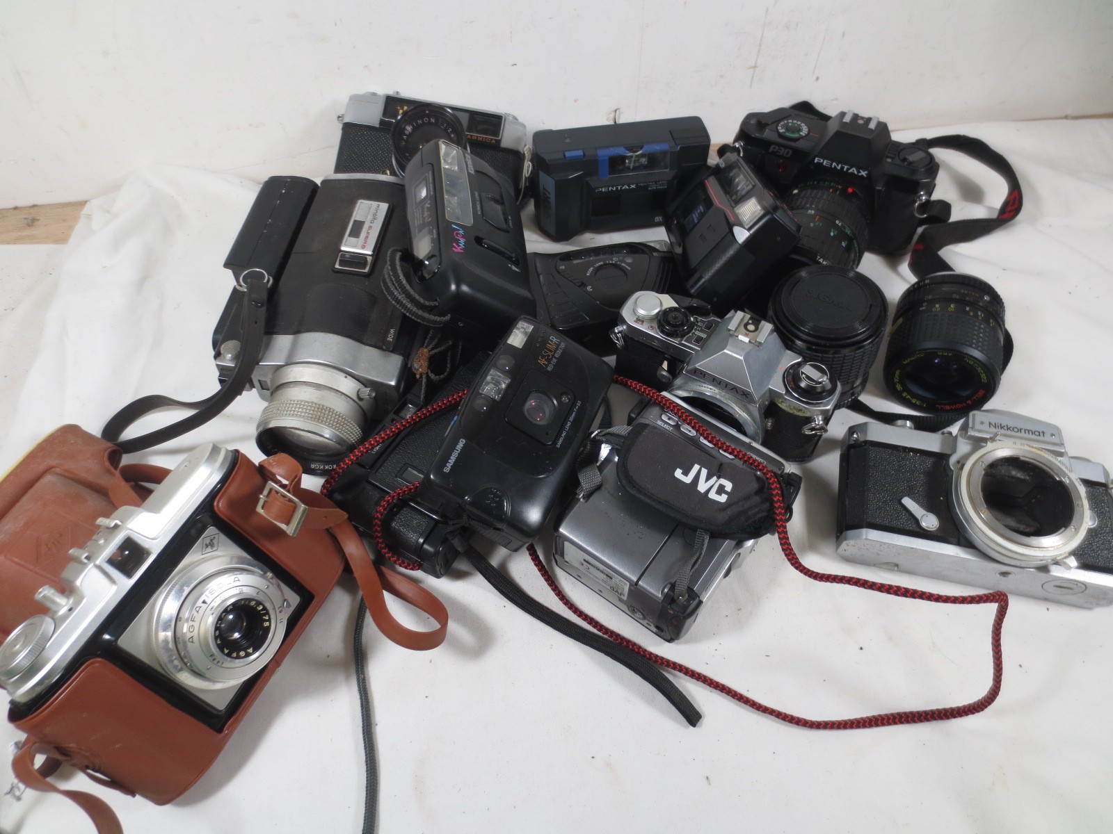 A box of assorted cameras