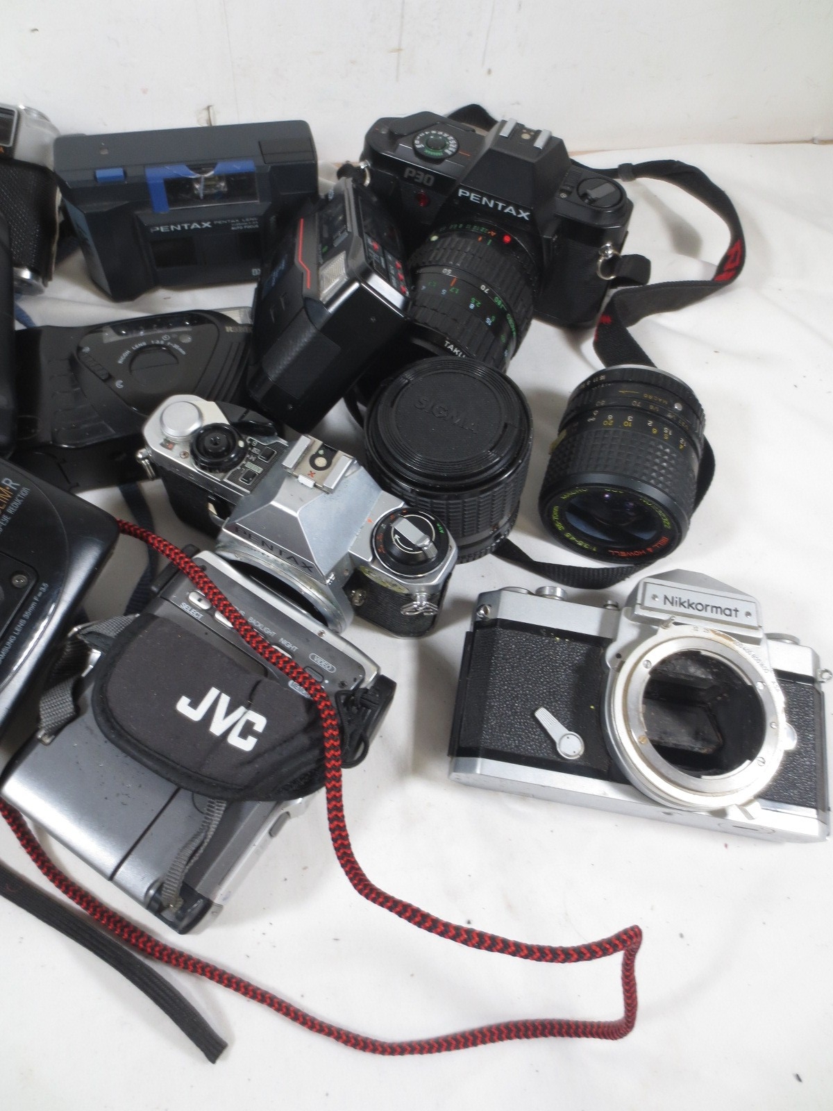 A box of assorted cameras