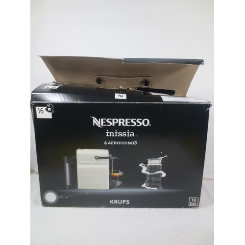 A Nespresso coffee machine in original box