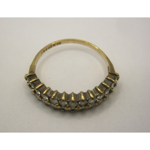 8 - A 9 carat gold dress ring set with two rows of small white faux stones,  British hallmarks, ring siz... 