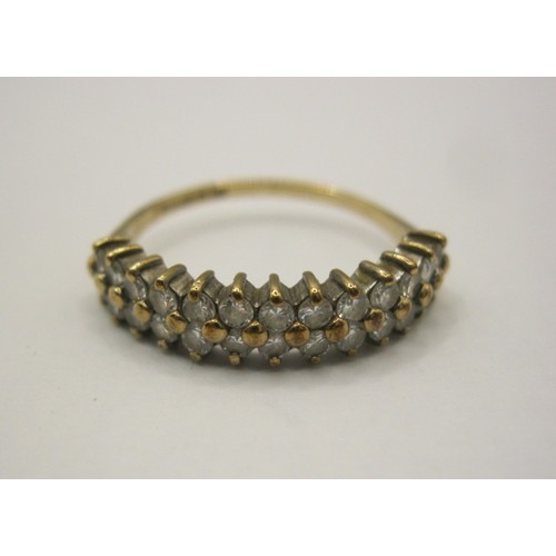8 - A 9 carat gold dress ring set with two rows of small white faux stones,  British hallmarks, ring siz... 