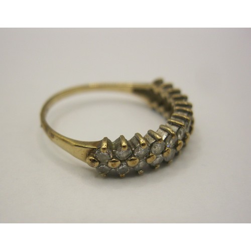 8 - A 9 carat gold dress ring set with two rows of small white faux stones,  British hallmarks, ring siz... 