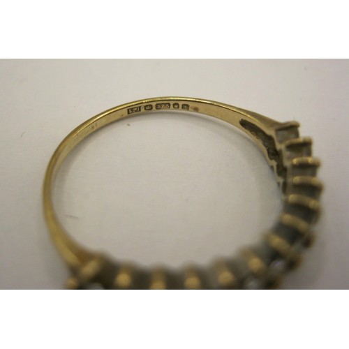 8 - A 9 carat gold dress ring set with two rows of small white faux stones,  British hallmarks, ring siz... 