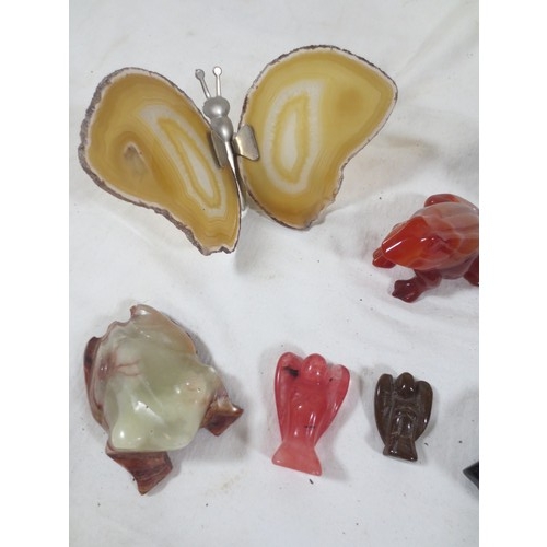 58 - A selection of small figures carved from stone including frogs, angels etc