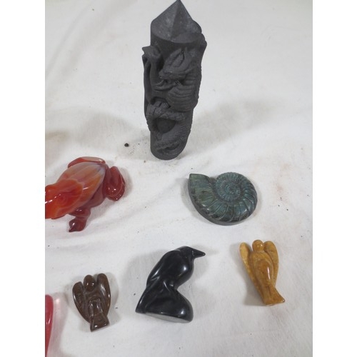 58 - A selection of small figures carved from stone including frogs, angels etc