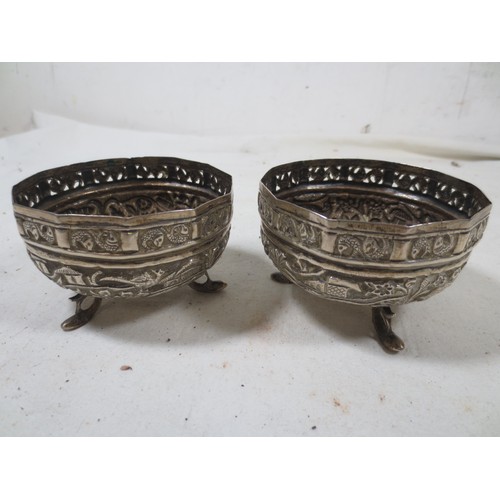 38 - A pair of antique Oriental, possibly Indian or Burmese, bon-bon dishes in white metal, acid tests as... 