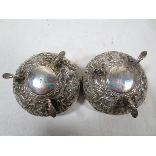 38 - A pair of antique Oriental, possibly Indian or Burmese, bon-bon dishes in white metal, acid tests as... 