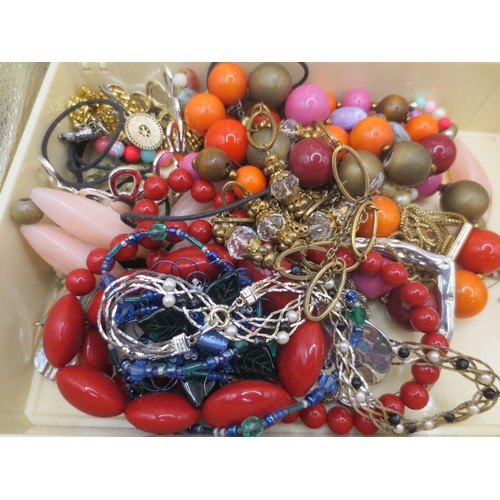 25 - A white plastic box with assorted costume jewellery,  and three boxed items of costume jewellery