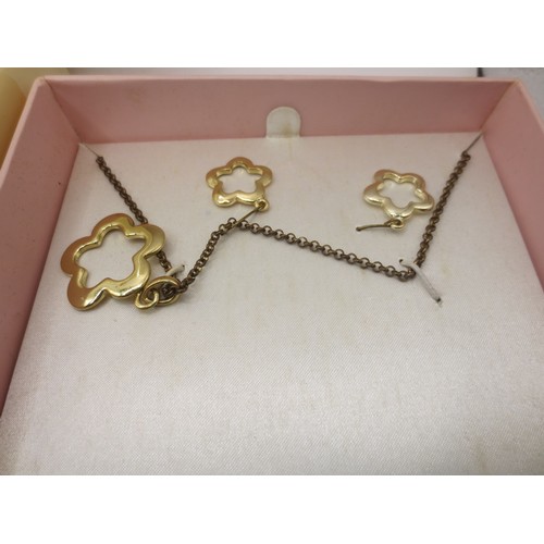 25 - A white plastic box with assorted costume jewellery,  and three boxed items of costume jewellery