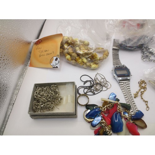 59 - A bag of assorted costume jewellery and a JASA quartz digital wrist watch (a/f requires new battery ... 
