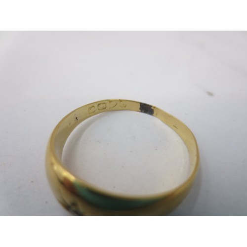 5 - A gold ring set with a small diamond in a flush star-engraved setting. Ring size R,  gross approx. 2... 
