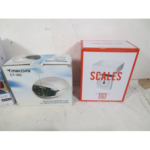 44 - A selection of household appliances to include Hand mixer ,set of kitchen scales, Radio alarm clock ... 