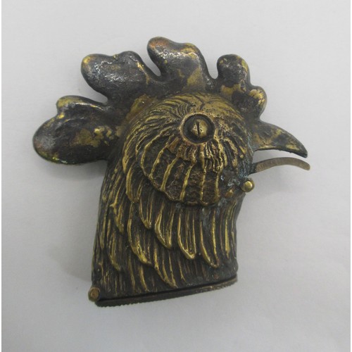 154 - A brass vesta in the form of a large cock's head, the spring-loaded lid released by pressing the bea... 
