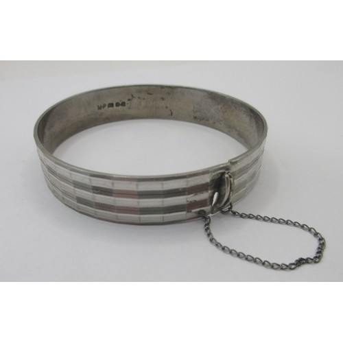 156 - A solid sterling silver bracelet with safety chain, hallmarked for London 1975 by Maylin, approx wei... 