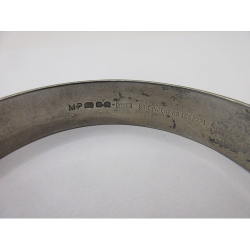 156 - A solid sterling silver bracelet with safety chain, hallmarked for London 1975 by Maylin, approx wei... 