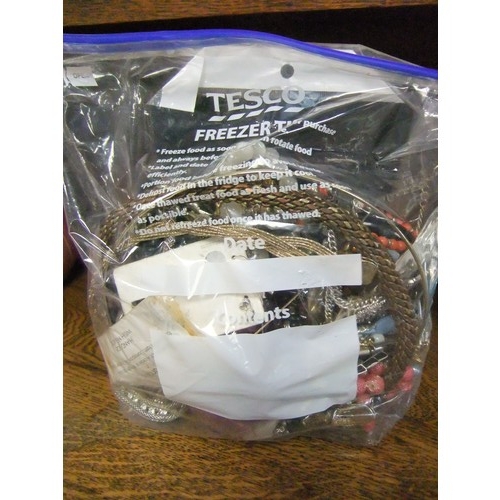 161 - A large bag of mixed costume jewellery