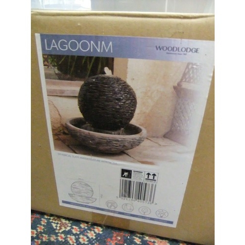 169 - A stoneware garden water featuring featuring a globe, boxed and unused