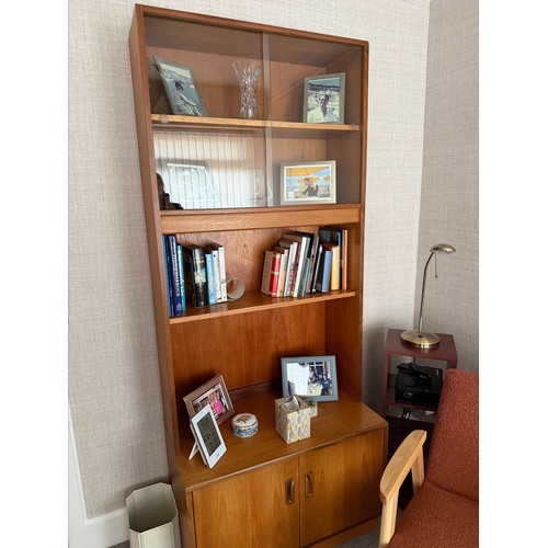 176 - A large G-Plan (E Gomme) wall unit, cupboard to base with shelves over, glazed to top, in excellent ... 