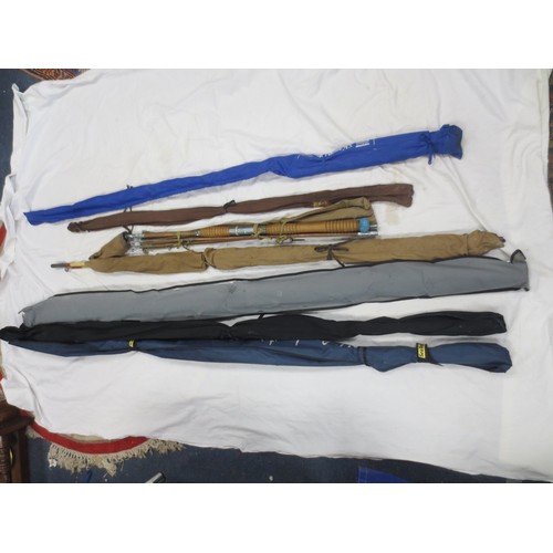 174 - A bundle of fishing rods including fly and beach fishing