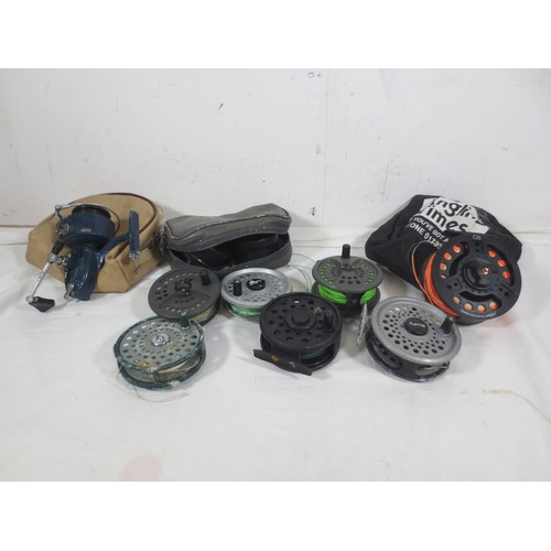 171 - A selection of 8 fishing reels, mainly fly fishing, plus various spools etc