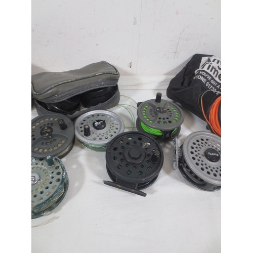 171 - A selection of 8 fishing reels, mainly fly fishing, plus various spools etc