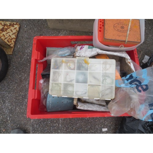 172 - A large red tub containing a mixture of fishing equipment including hooks, line etc