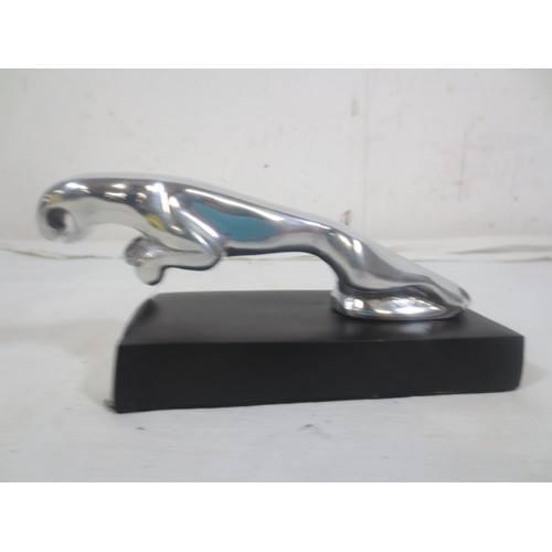 180 - A 'leaping cat' bonnet ornament mounted on a plinth