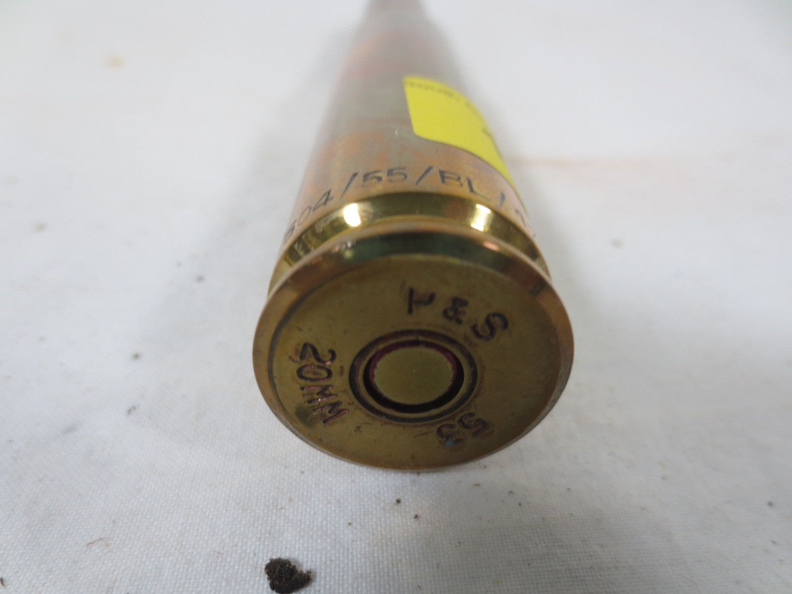 A 20mm shell case and projectile in good order, marked 20mm SZA
