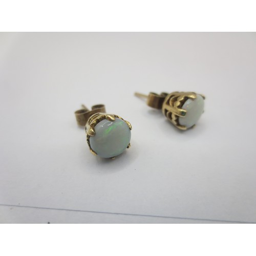 125 - A pair of 9 carat gold opal earrings,  combined approx. 2.5g,  British hallmarks to shafts, the butt... 