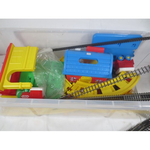 235 - Plastic tub full of toy trains and railways including some Hornby track, some of which is slight af