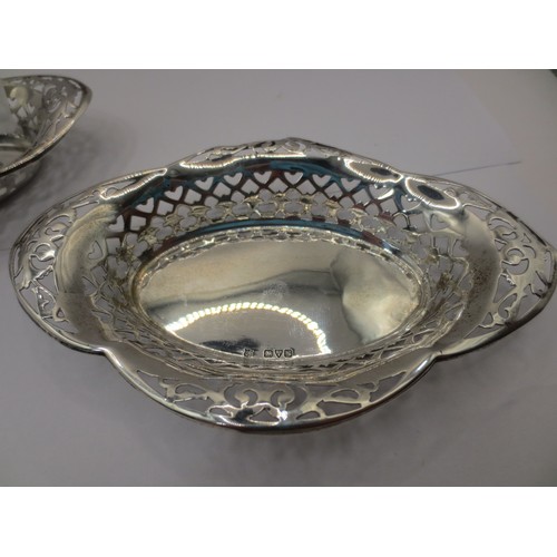 65 - A pair of silver bon bon dishes of lobed oval form with pierced rims, each with marks for Chester, 1... 