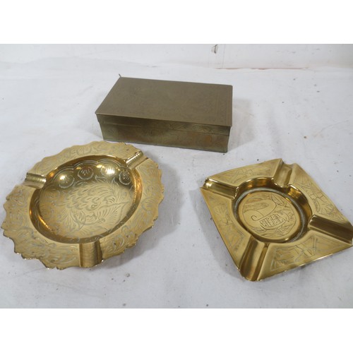 197 - A Chinese wood lined Cigarette box along with two engraved Brass ashtrays .