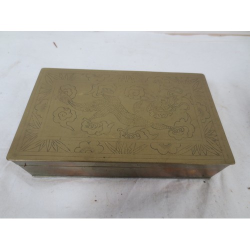 197 - A Chinese wood lined Cigarette box along with two engraved Brass ashtrays .