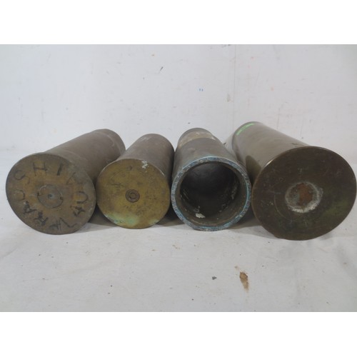 A selection of 4 artillery shell cases including a 1916 dated 18 pounder