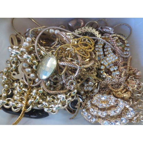 67 - A tub of gold-tone costume jewellery
