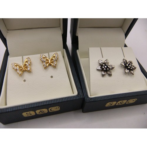 262 - Two pairs of 925 silver earrings.  (1) flower head, blue presentation box.  (2) butterfly, gold-tone... 