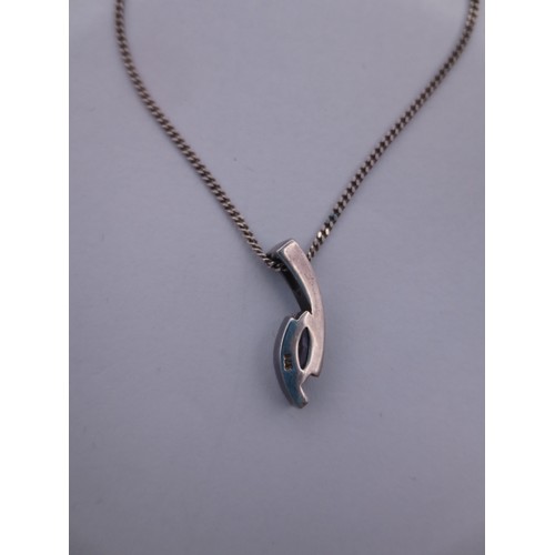 76 - A 925 silver chain and pendant set with a bluish pink stone