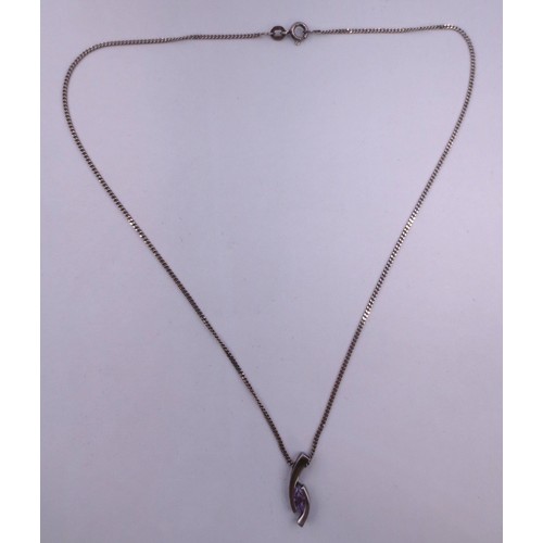 76 - A 925 silver chain and pendant set with a bluish pink stone