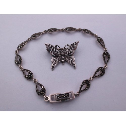 77 - A 925 silver and marcasite bracelet,  and a butterfly brooch stamped silver