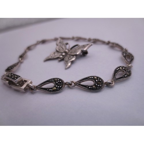 77 - A 925 silver and marcasite bracelet,  and a butterfly brooch stamped silver