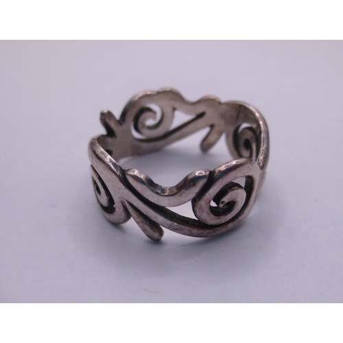79 - A 925 silver scrolled band ring,  size M,  stamped 925 partially distinct,  with a black ring box