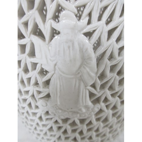 20 - A Blanc de chine vase with pierced decoration and  raised Wisemen figurines decoration all around as... 