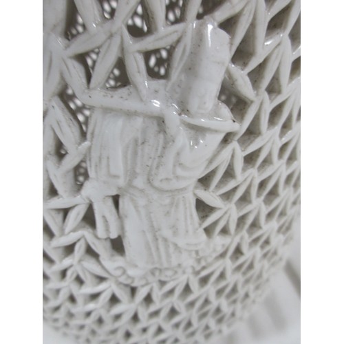 20 - A Blanc de chine vase with pierced decoration and  raised Wisemen figurines decoration all around as... 