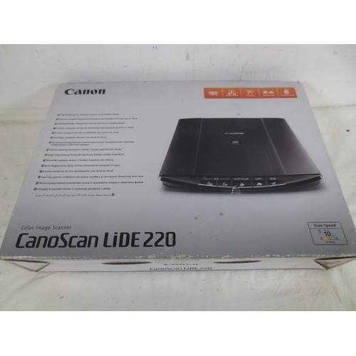 An a/f Canon Canoscan Lide 220 color image scanner with box, and an a/f ...