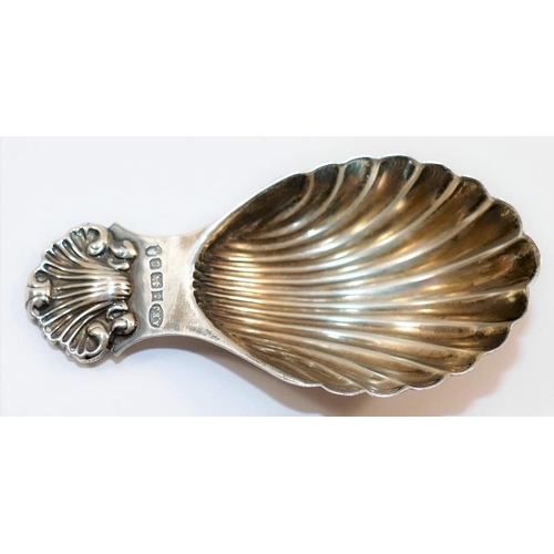 105 - A Victorian style silver caddy spoon with shell bowl and handle, Birmingham 1977 by A E Jones with j... 