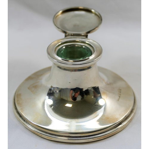 133 - An Edwardian silver capstan inkwell, Birmingham 1905 by Thomas H Hazelwood, with glass well and load... 