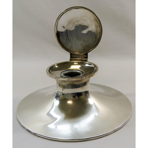 140 - A large silver capstan inkwell, initialed 'CW' to the lid, with glass well and loaded base, marks ru... 