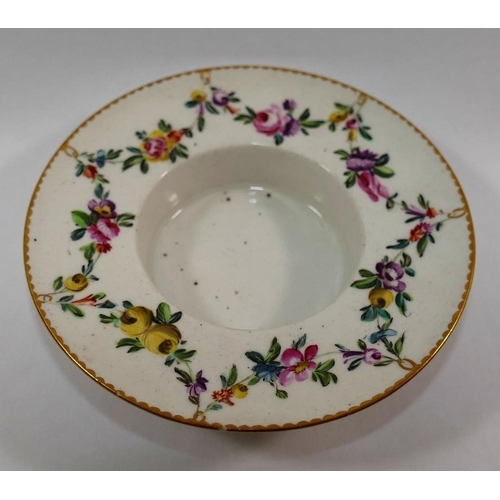 18 - An 18th century Derby porcelain trembleuse cup and saucer, hand painted in enamels with floral swags... 