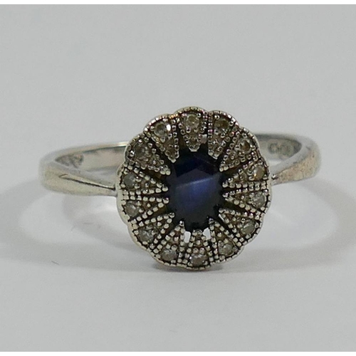 182 - A sapphire and diamond oval cluster ring, the shank stamped '925', finger size O 1/2, and a silver s... 